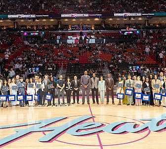 Miami HEAT Game with 15 scholarship winners on the court.