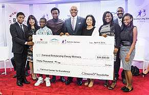 Linda Coll of Carnival Foundation (left) joins Arnold Donald of Carnival Corporation and Lydia Muniz of Big Brothers Big Sisters of Miami with the scholarship winners.