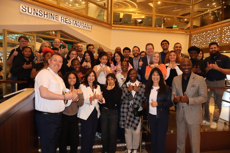 Christine Duffy (front row, third from left) joined the seniors, their mentors, Carnival Sunrise's captain and Gale Nelson, president and CEO of Big Brothers Big Sisters of Miami, for a photo.