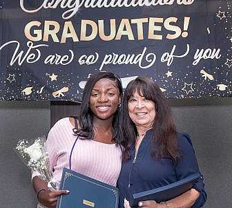 Linda Coll and graduating senior.