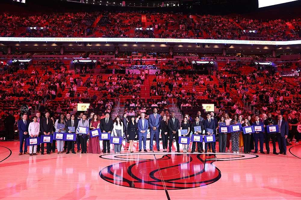 The Carnival Scholarship & Mentoring Program Scholarship winners at the MiamI HEAT game.